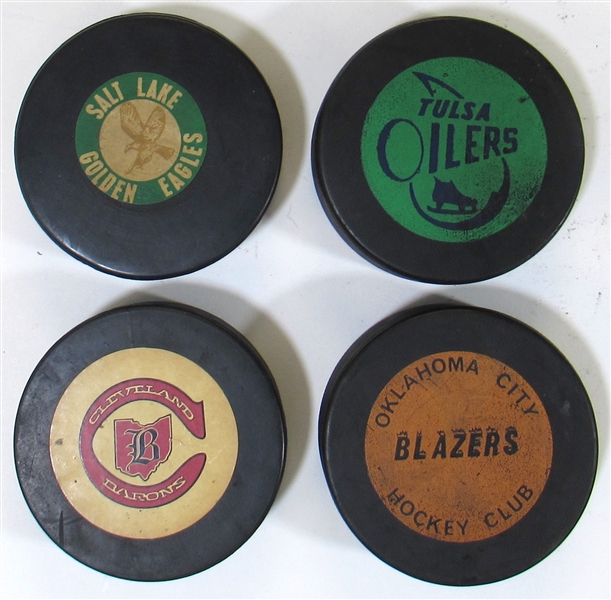 Lot of 4 NHL/CHL GU Hockey Pucks Cleveland Barons, Salt Lake City Golden Eagles, Oklahoma City Blazers, and Tulsa Oilers