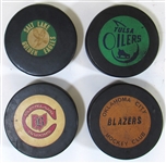 Lot of 4 NHL/CHL GU Hockey Pucks Cleveland Barons, Salt Lake City Golden Eagles, Oklahoma City Blazers, and Tulsa Oilers