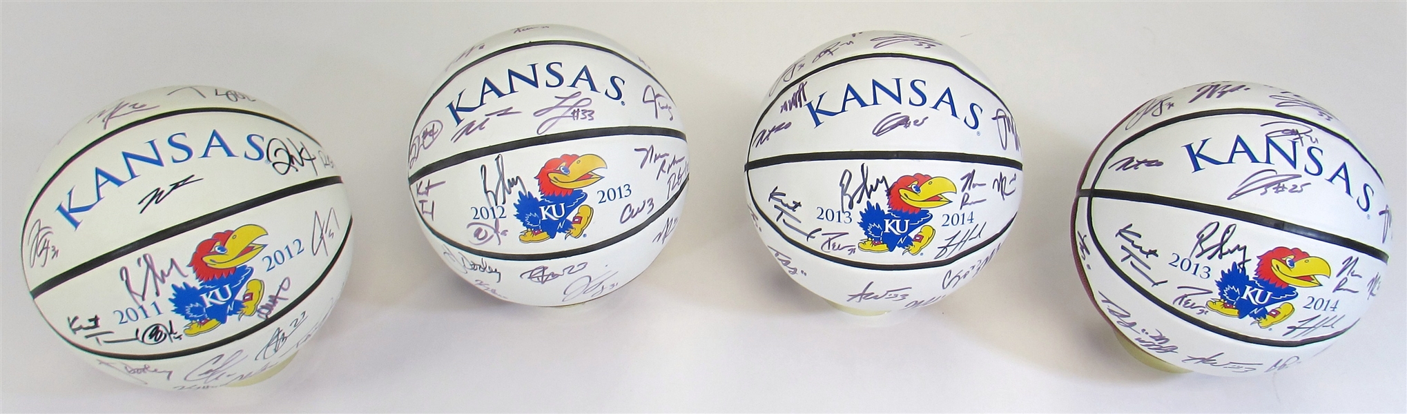 Lot of 4- KU Team Signed Balls (2011-12, 2012-13, & 2x 2013-14)